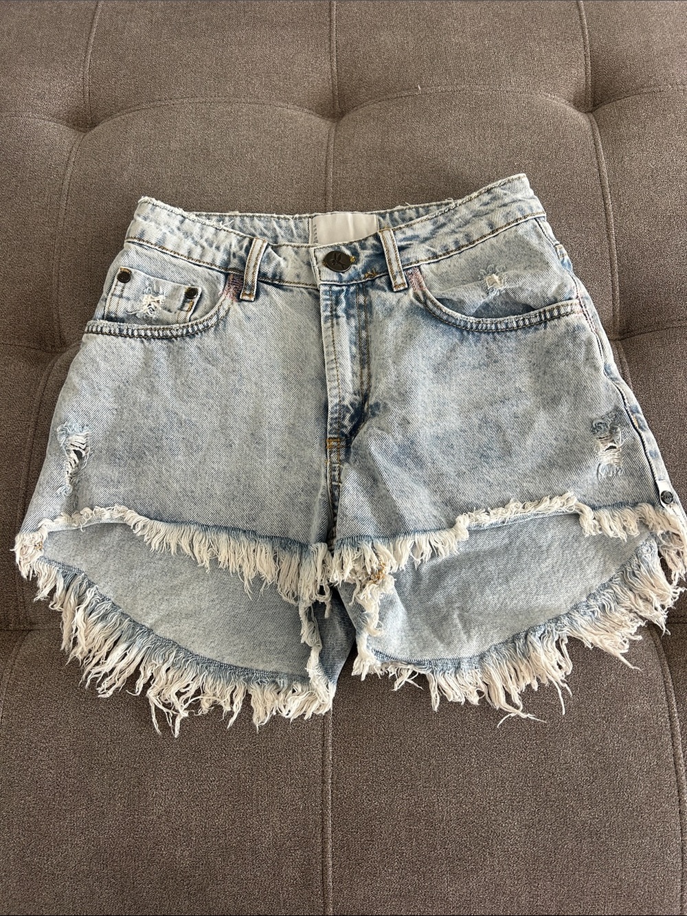 High-Rise Light Blue Distressed Denim Shorts with Frayed Hem